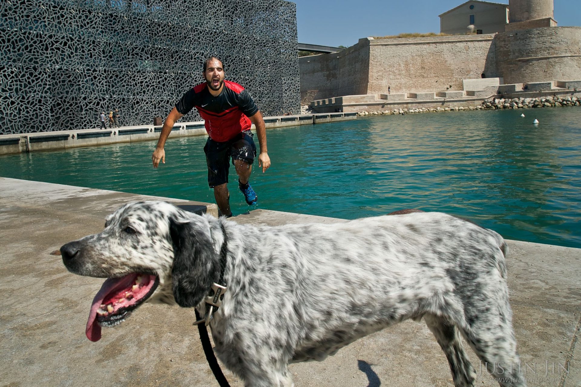 A man takes a dip in the sea in front of the "MUCEM" museum in Marseilles. For Der Spiegel Magazine.